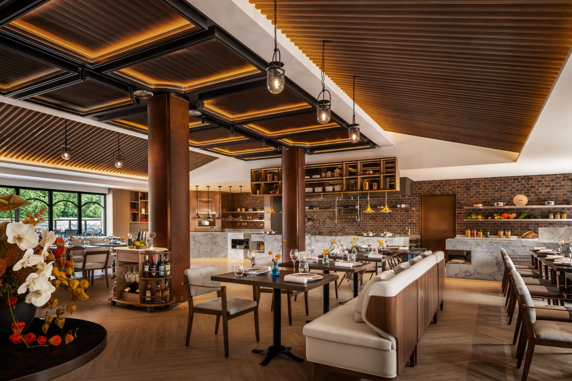 Restaurant with wooden ceiling beams, parquet floors, and modern white furniture