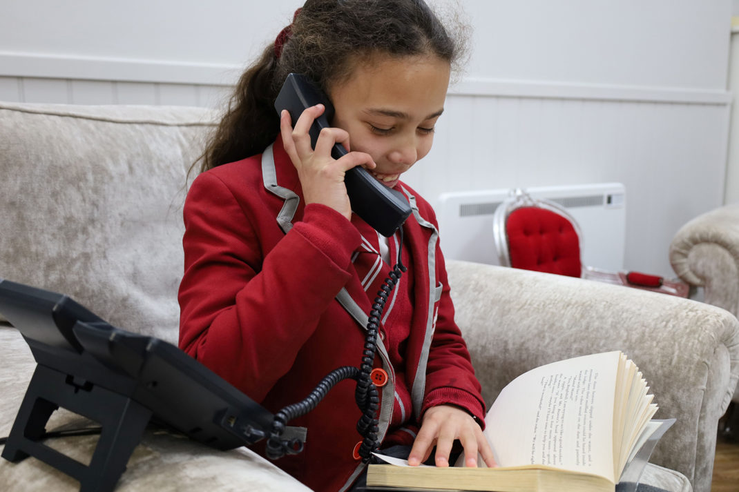 New Hall School Girl on Phone for Charity Initiative