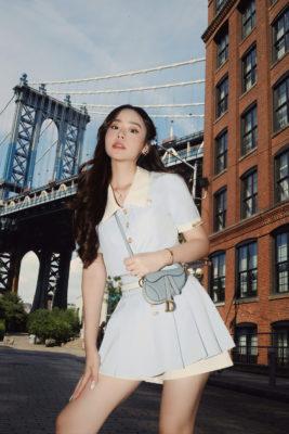 Woman with designer bag | Vestiaire Resale Buying Guide
