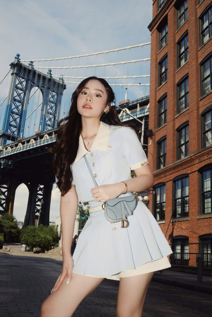 Woman with designer bag | Vestiaire Resale Buying Guide