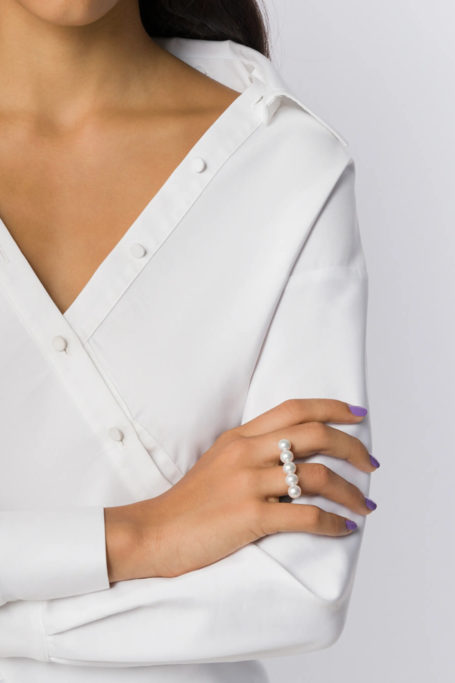 Close up of woman's hand wearing ring