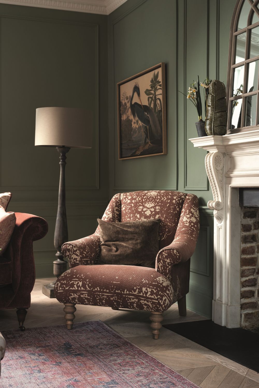 Forest green living room with brown textured armchair