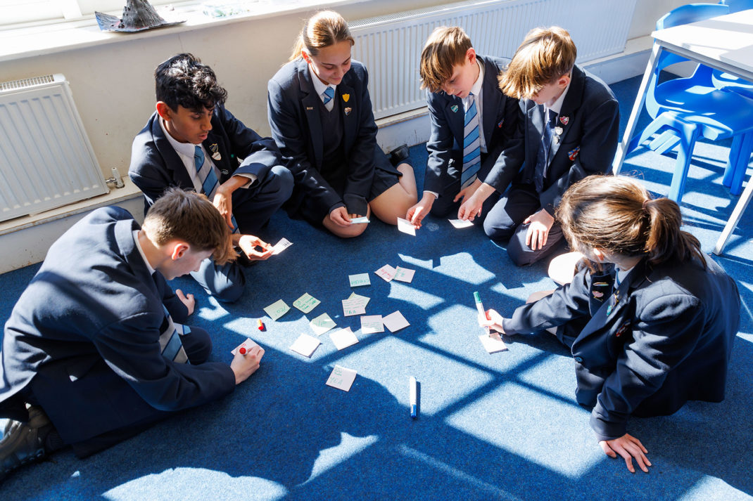 Belmont, Mill Hill Prep Students on classroom floor