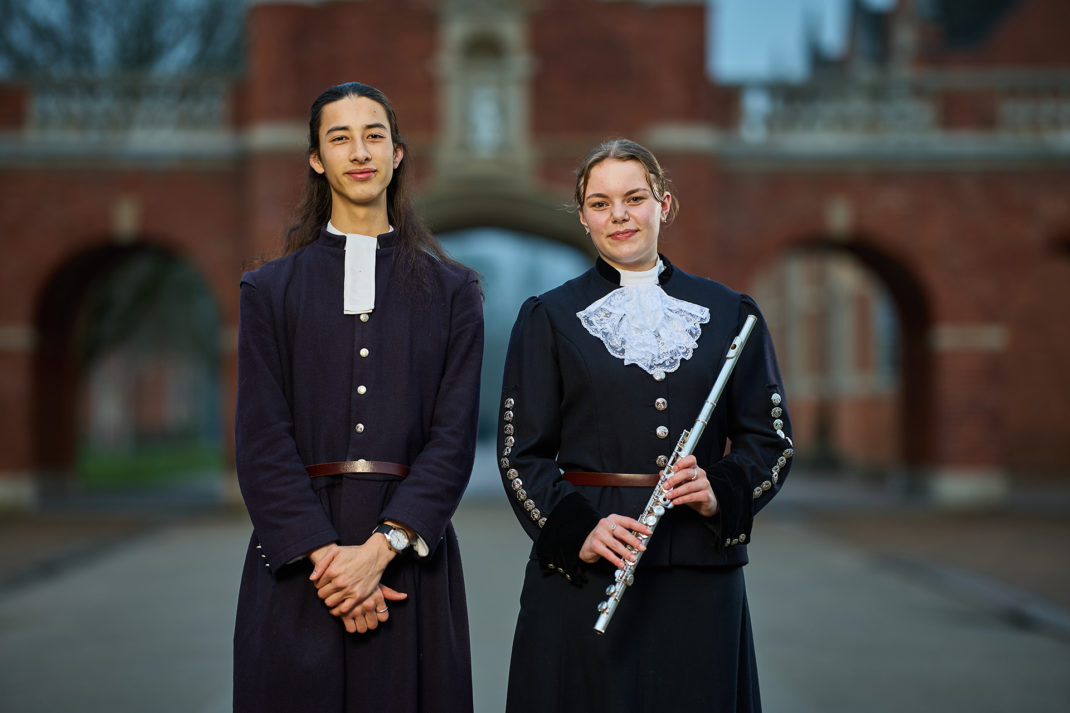 Two Christ's Hopsital students in uniform one with a flute