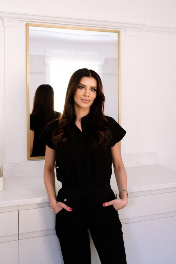 Dr Sindhu Siddiqi wearing black scrubs