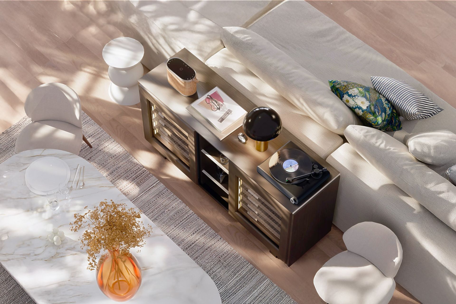 Aerial view of living room with white sofa, white marble dining table, and oak wine cabinet with a record player on top