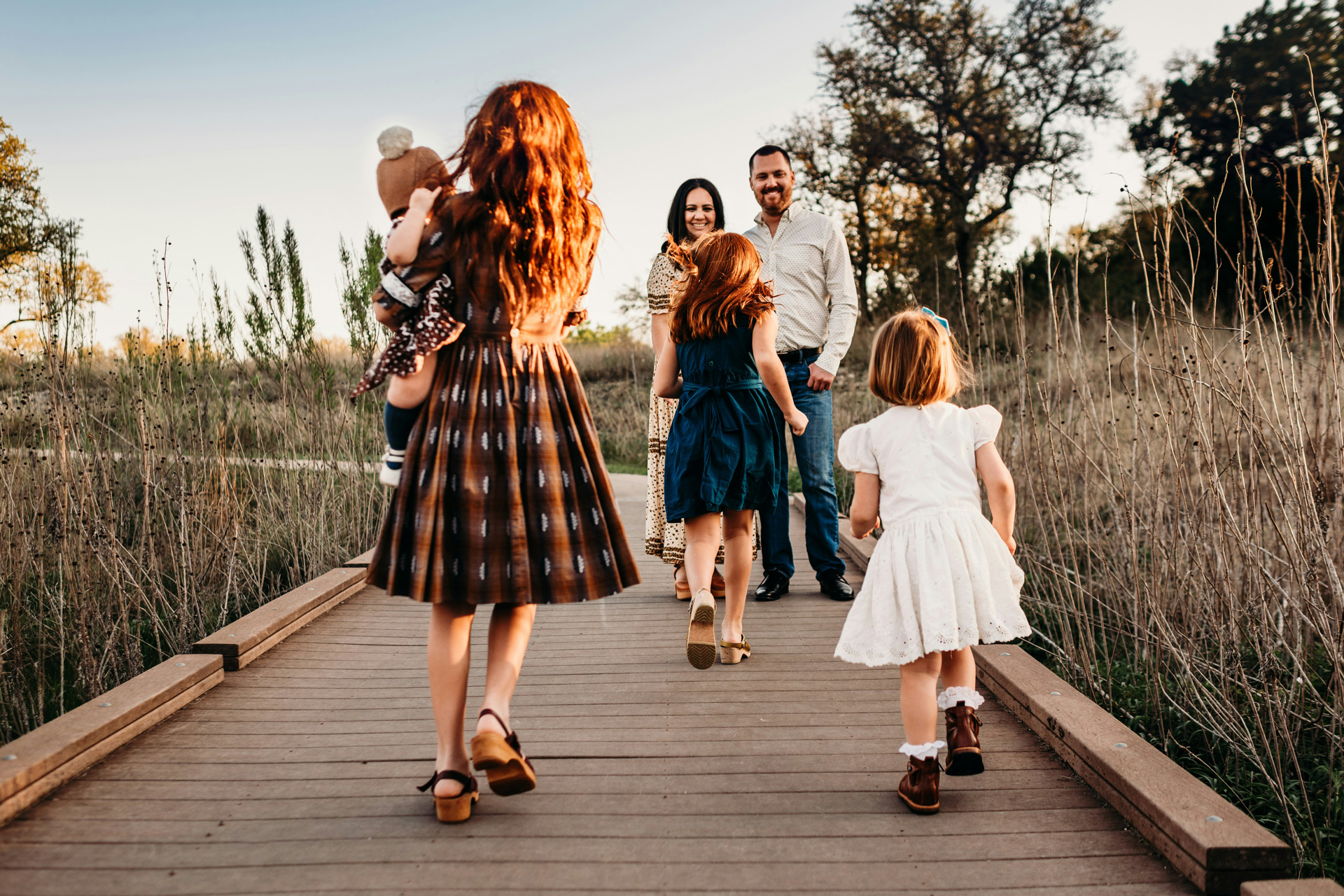 Family running towards one another