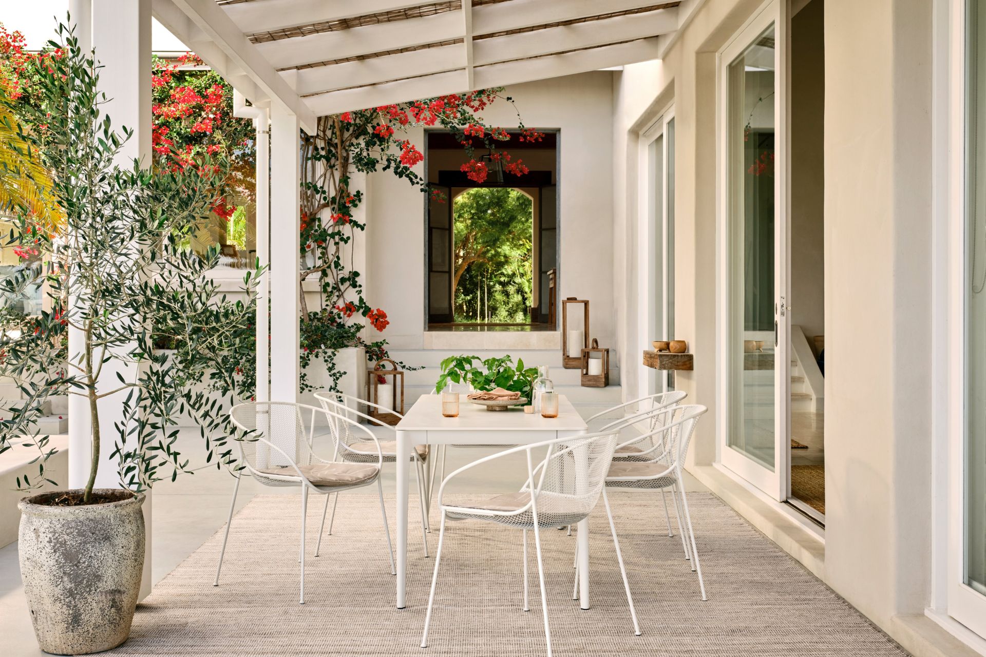 Outdoor terrace with white dining furniture