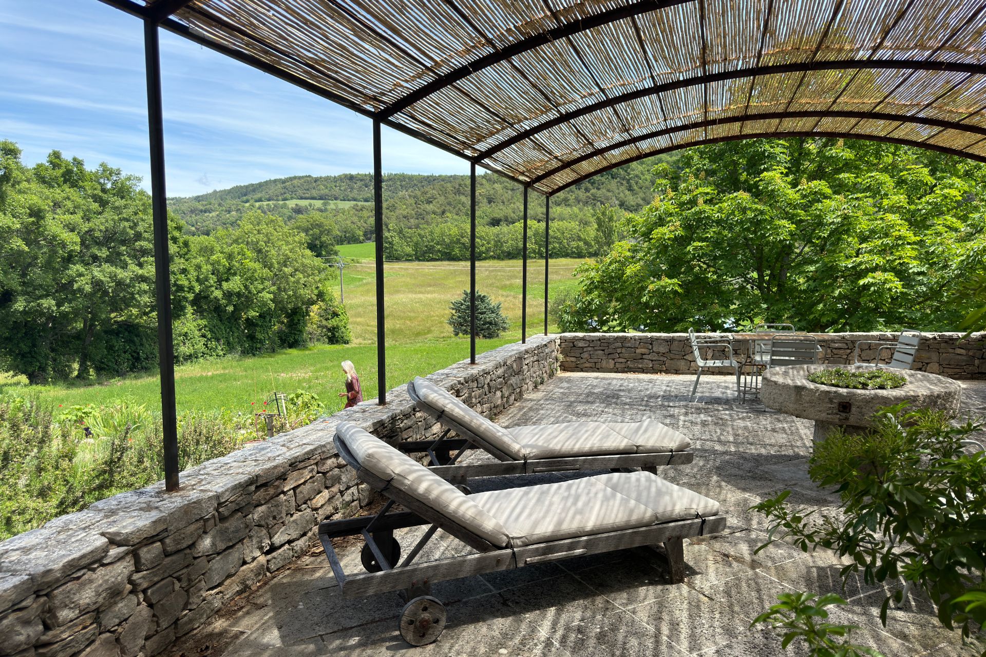 Covered terrace with white sun loungers
