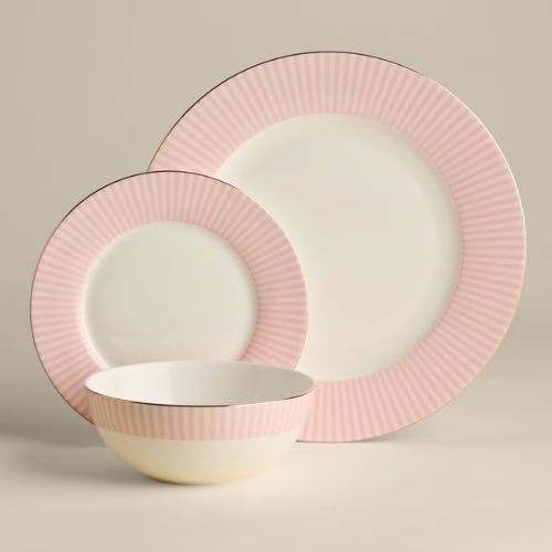 Cream plates with pink edges and gold trim