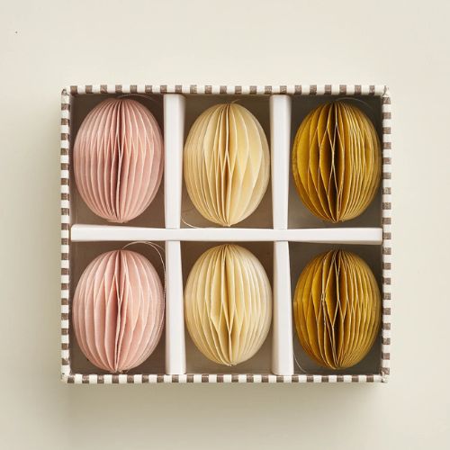 Striped box of pale pink, cream and brown paper egg decorations