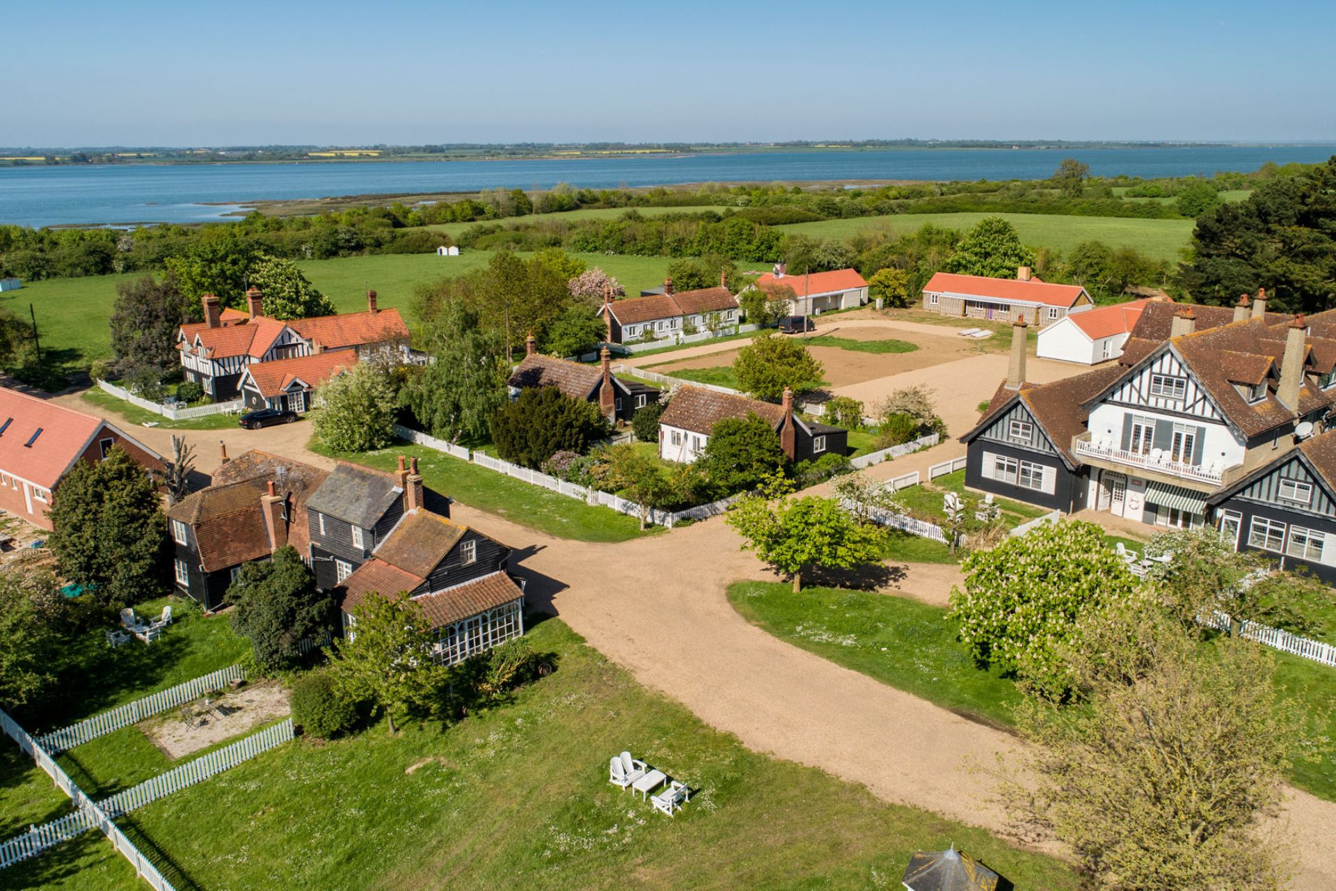 Aerial view of island with gravel paths and Edwrdian homes