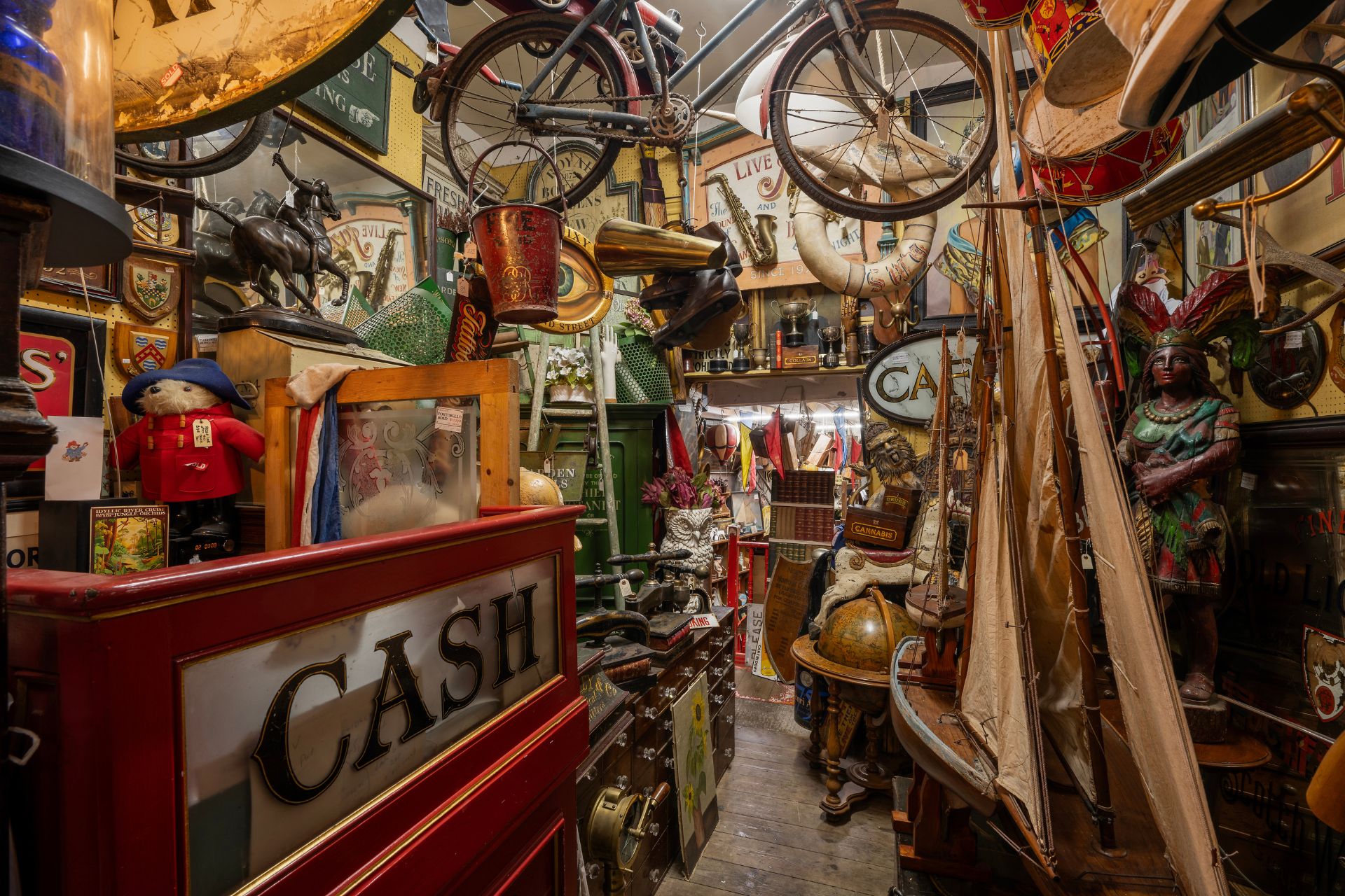 Antique shop interior with old bikes, signs and decor