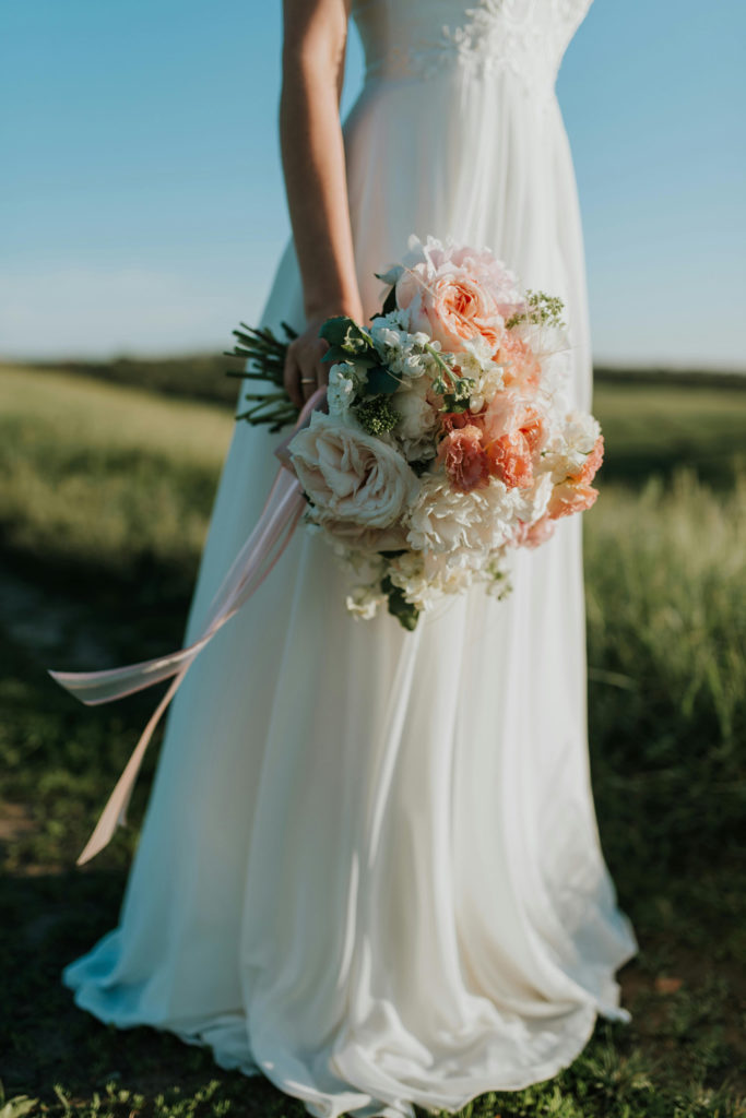 A bride holding a bouquet of flowers