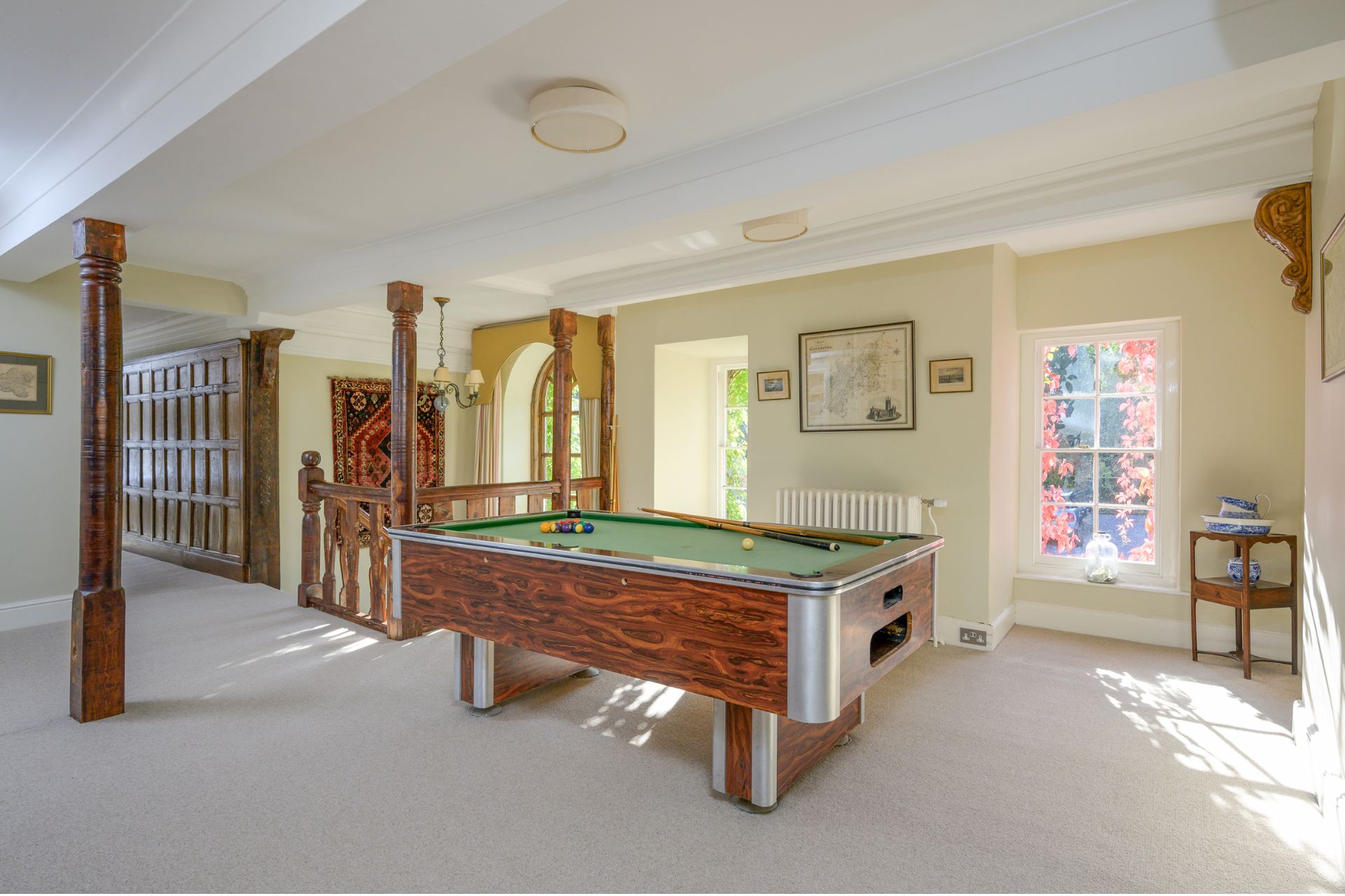 Country home with pool table in a games room