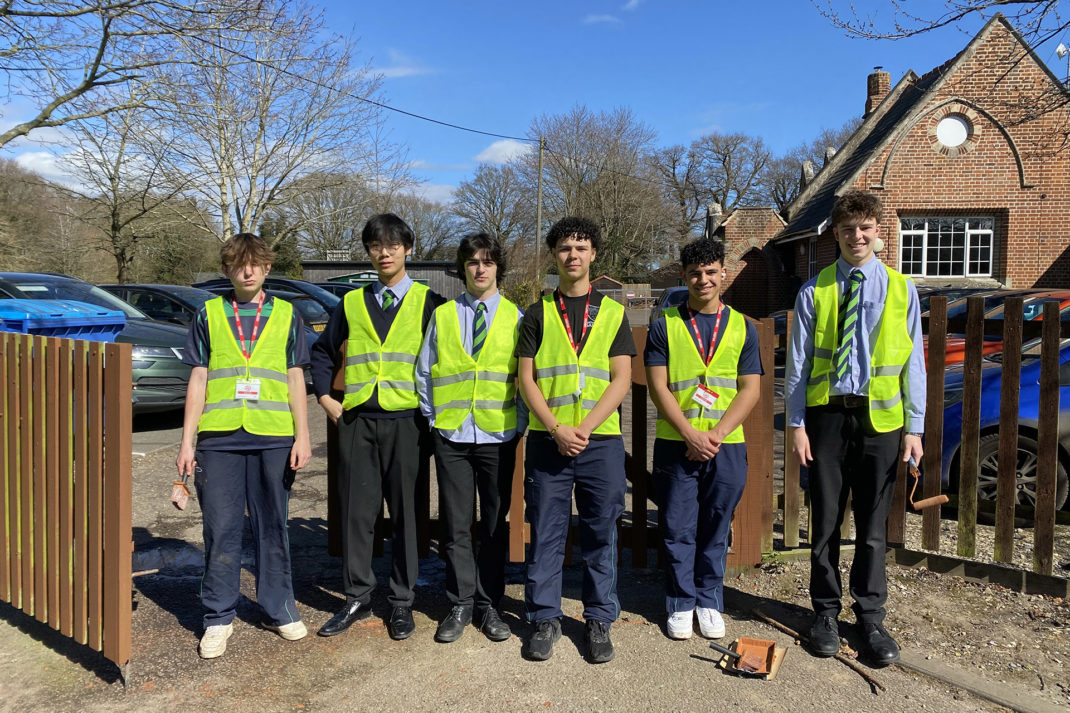 Royal Hospital School Student in high vis doing community service