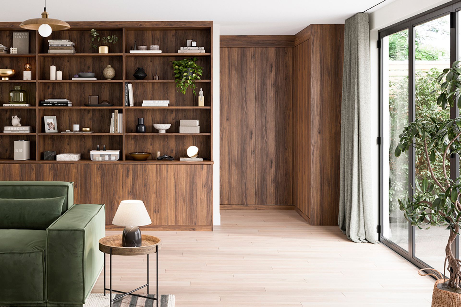 Living area with forest green velvet sofa, wooden floors, a built-in shelving unit, and floor-to-ceiling sliding doors
