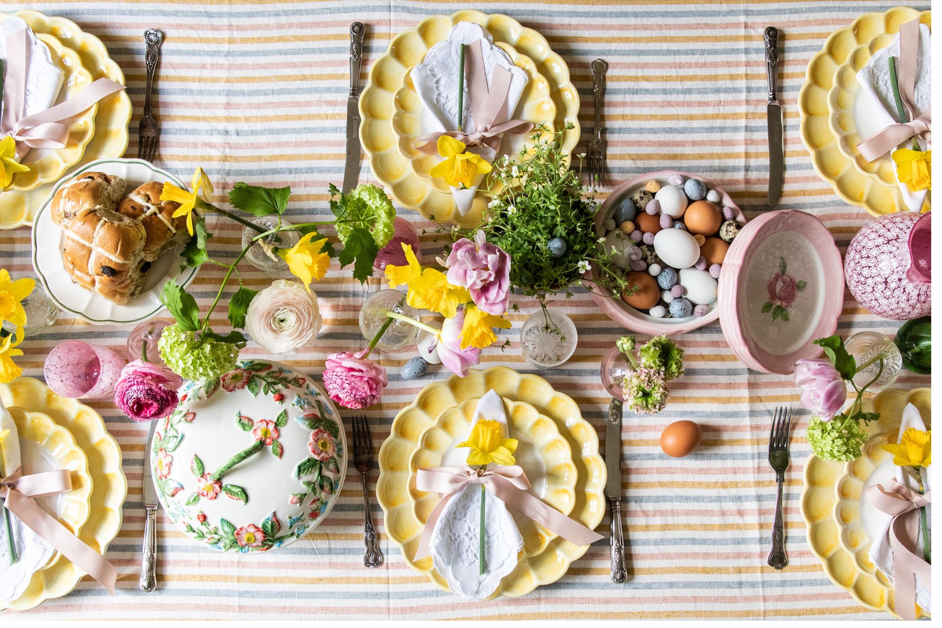 Strped pastel tablecloth with butter yellow floral plates and daffodils