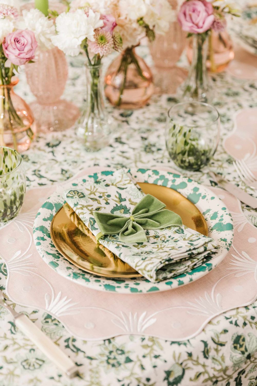 Pink and green floral table with pink glassware