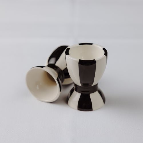 Black and white striped egg cups