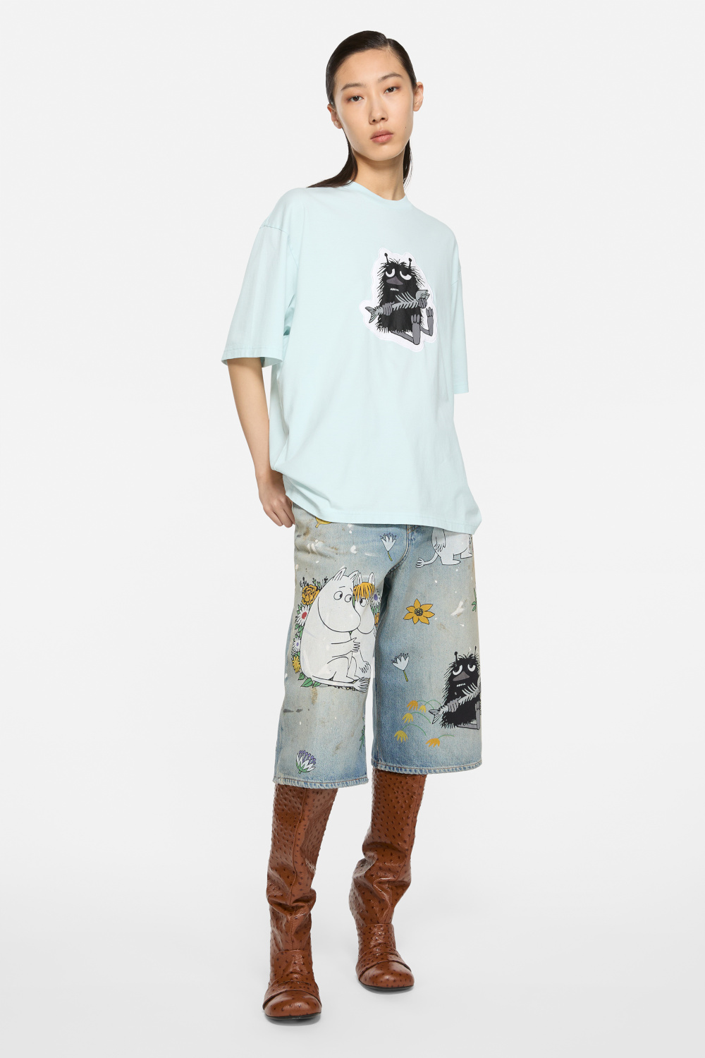 Woman wearing T-shirt and shorts from the Acne Studios x Moomin collab