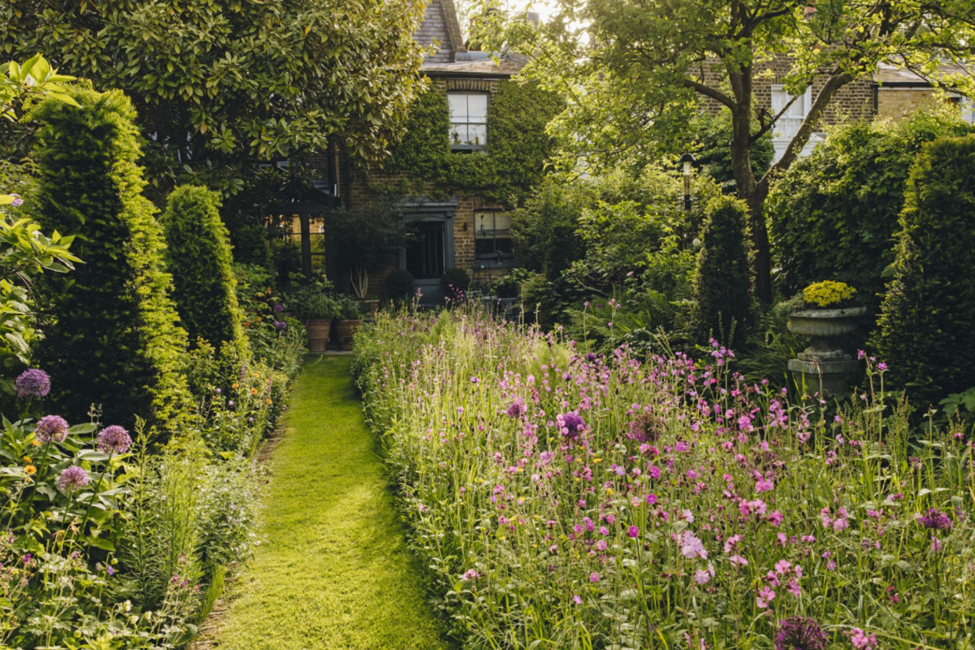 Flower garden with ivy-covered shed