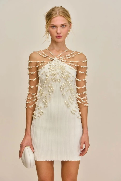 Woman wearing Cult Gaia mini dress