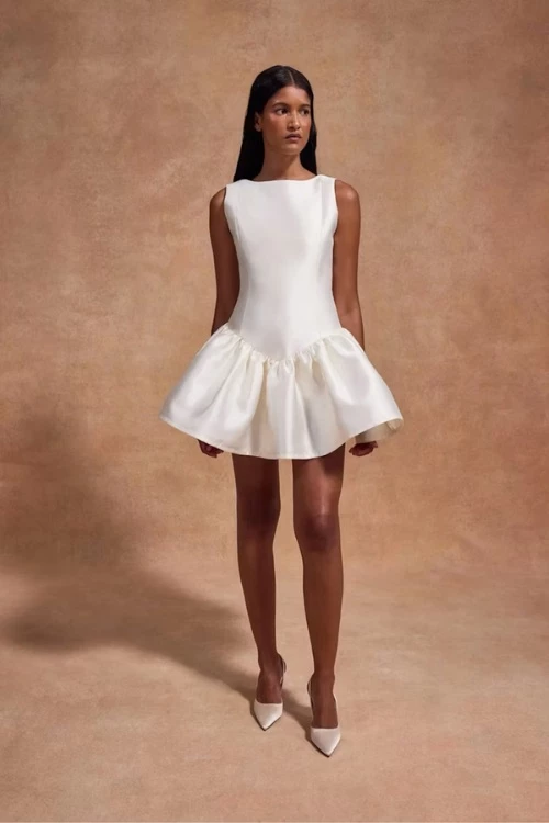 Model wearing De La Vali short wedding dress
