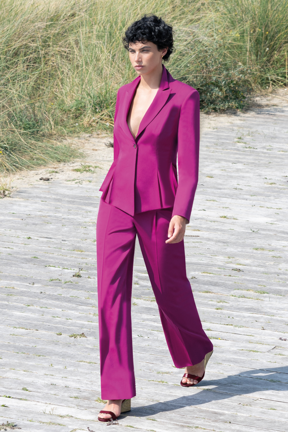 Woman in pink suit