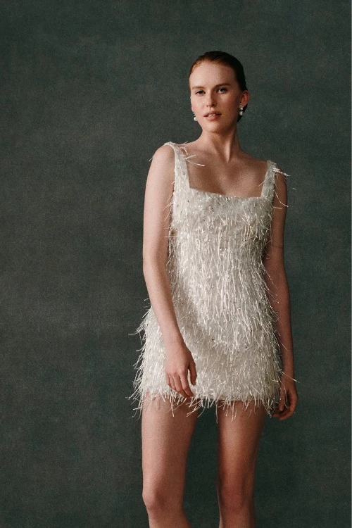 Woman wearing Emilia Wickstead short wedding dress