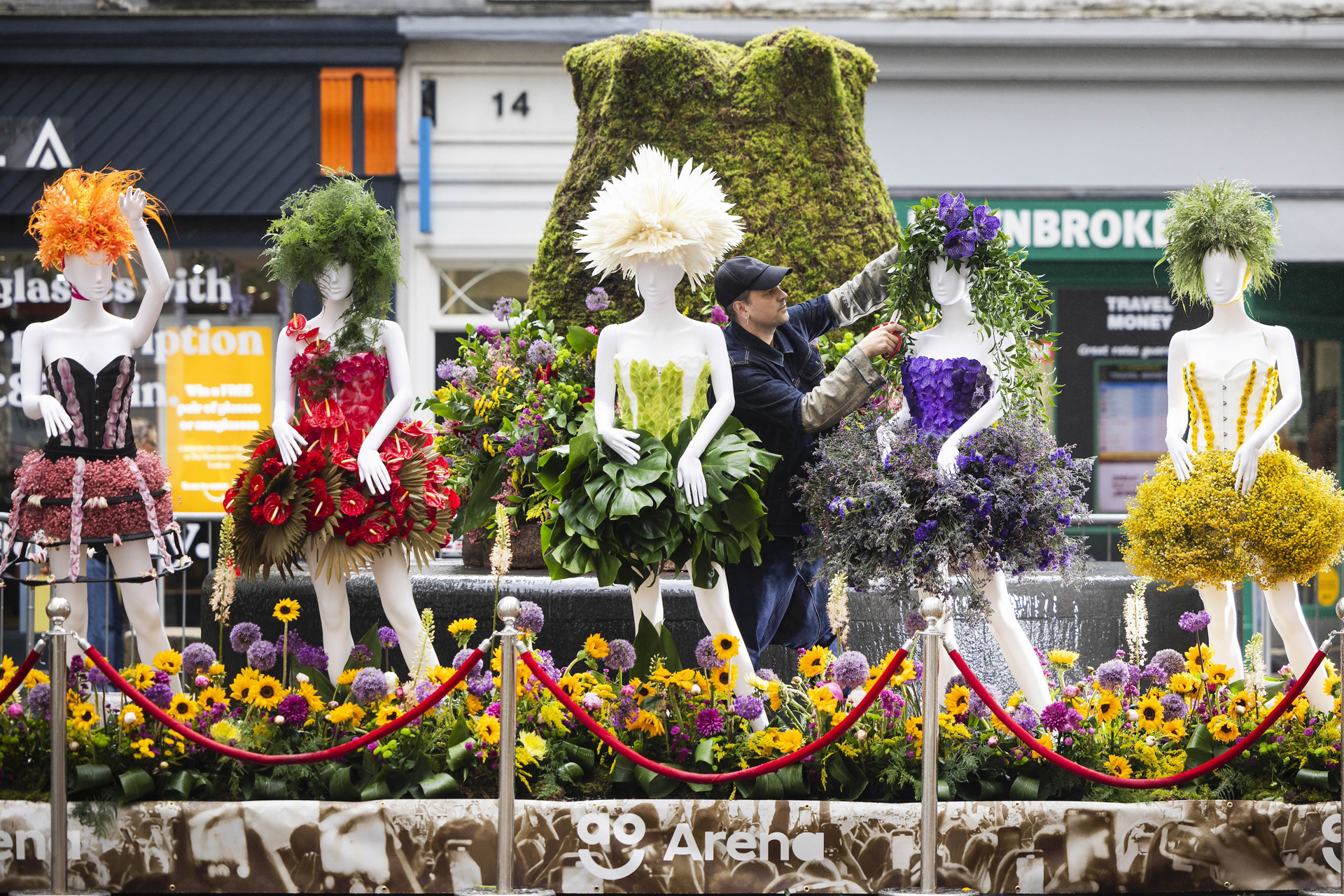 Florist Adi Thomas adds the finishing touches to his installation at the Girls Aloud Tribute Garden on display at The Manchester Flower Festival 2024
