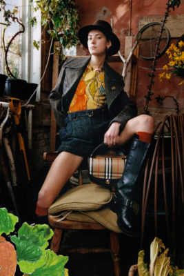 Woman wearing sat in shed