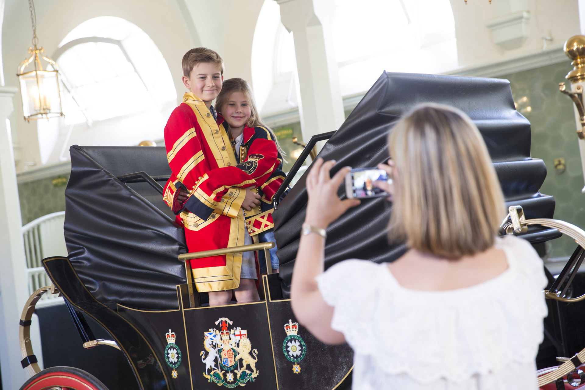 Photos with the replica Landau in situ at the Royal Mews, Buckingham Palace, London