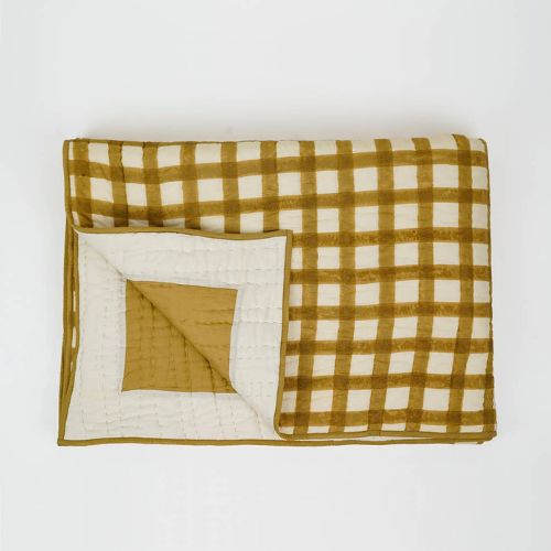 Mustard yellow and white block print quilt