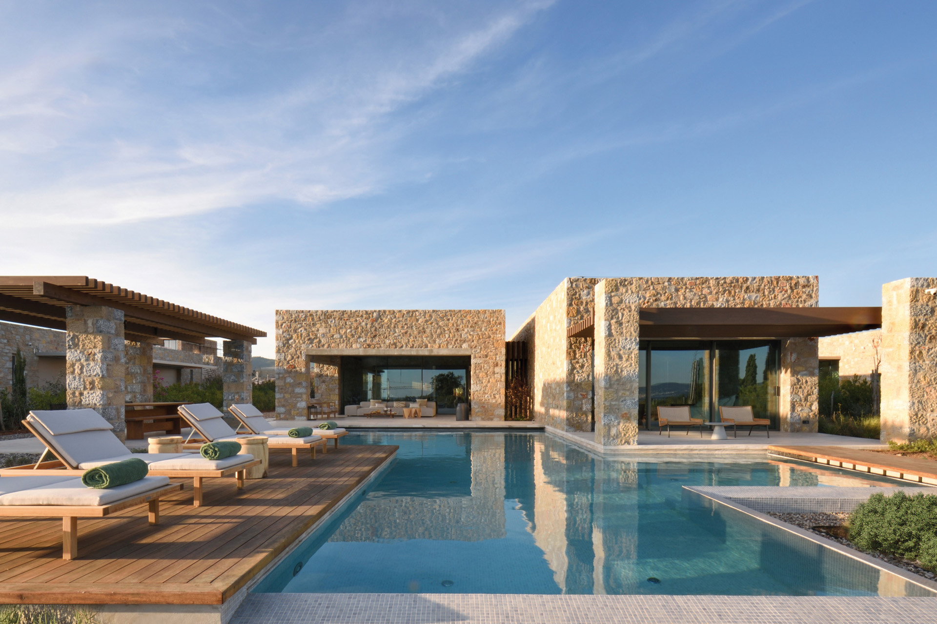 Loungers by the pool at a villa