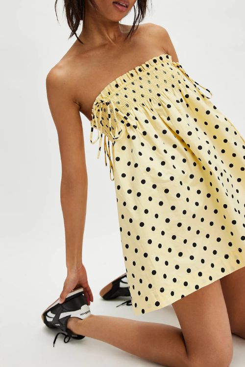 Yellow and black polka dot mini dress