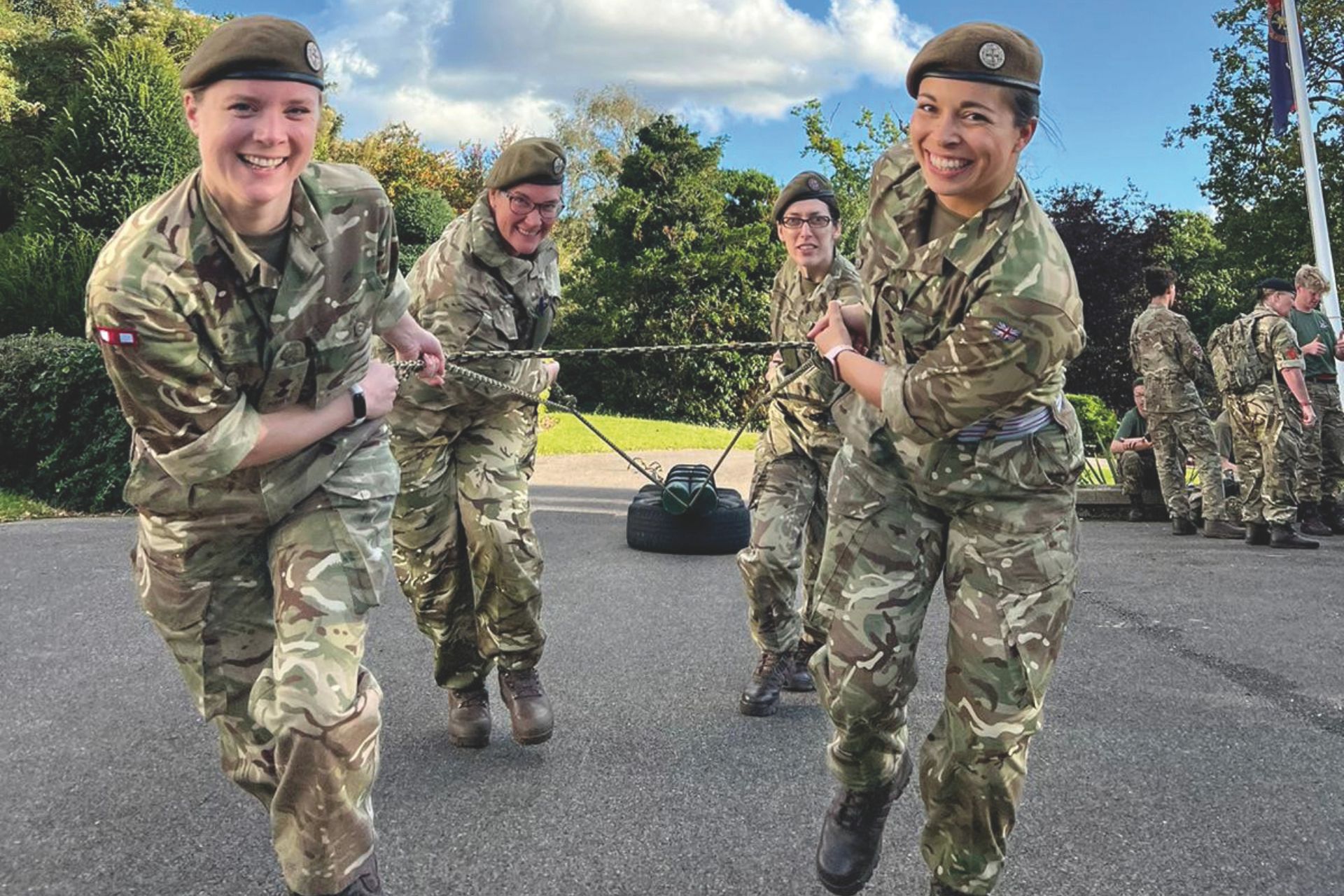 Female cadets on a training day, pulling a tyre
