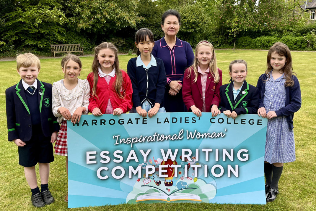 Harrogate Students with competition banner
