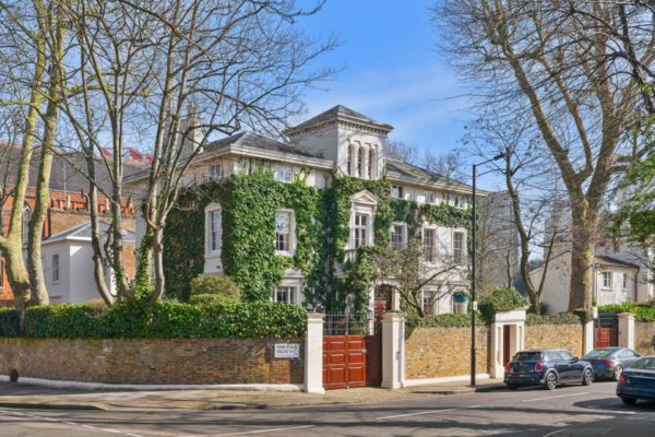 Exterior of ivy-clad Italinate mansion