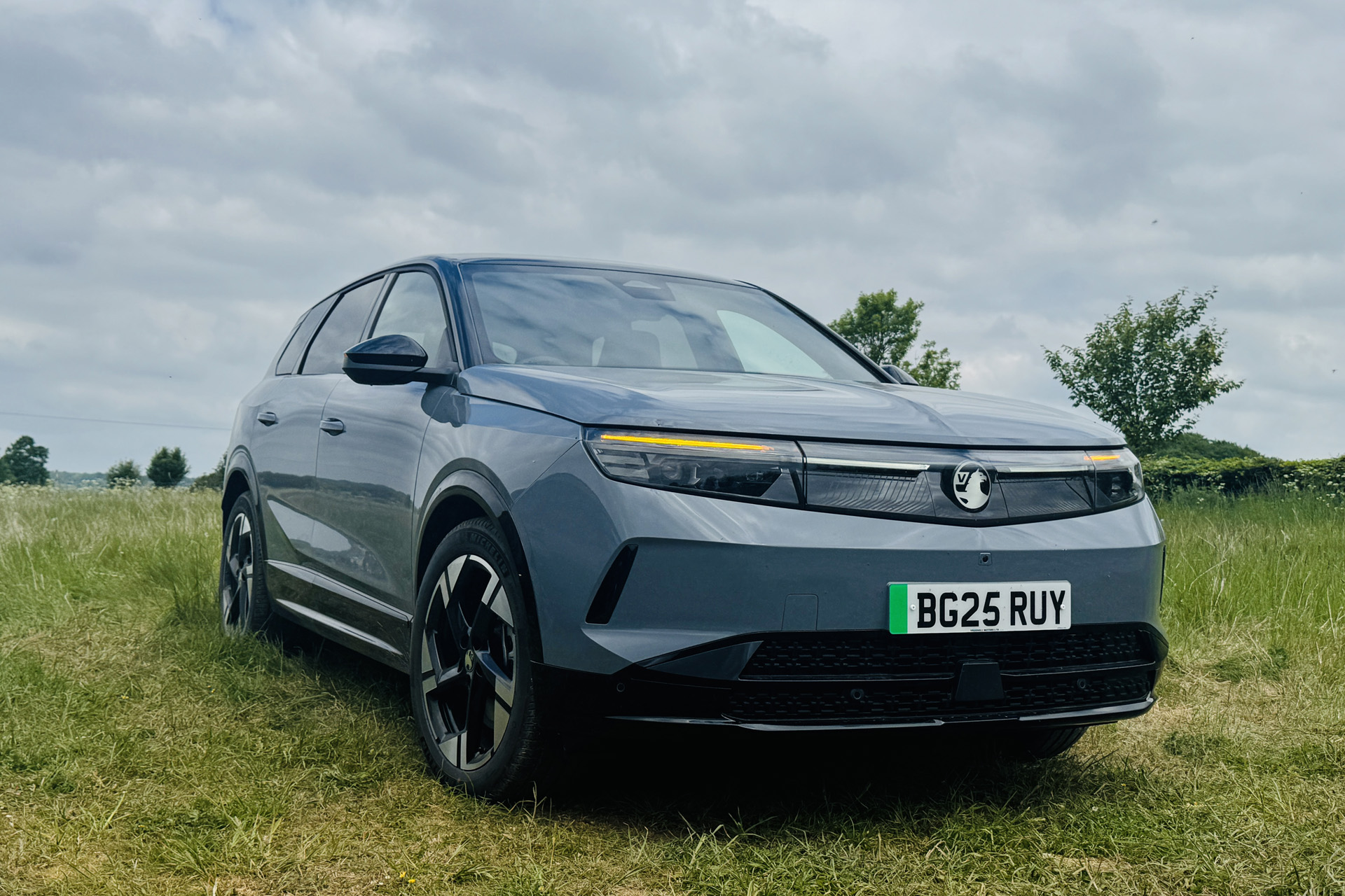 The Vauxhall Grandland Electric on a grass bank