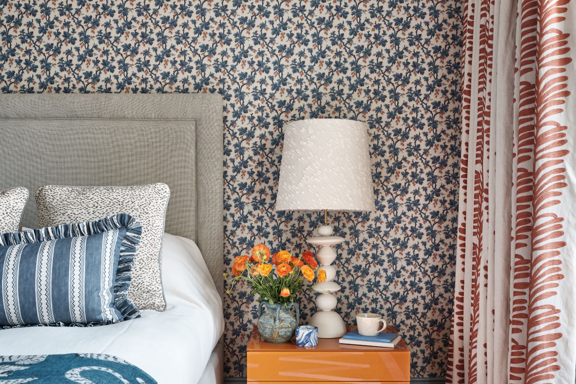 Bedroom with blue and white floral wallpaper