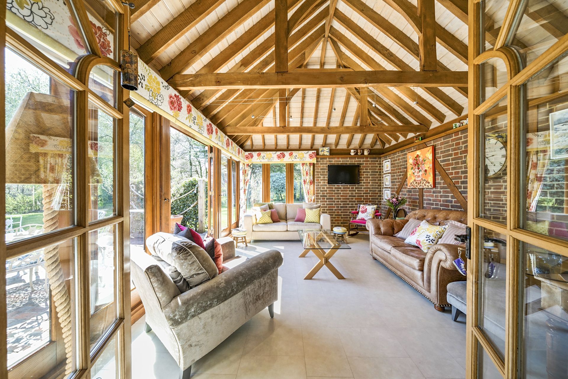 Garden room with vaulted oak ceiling and floor-to-ceiling windows