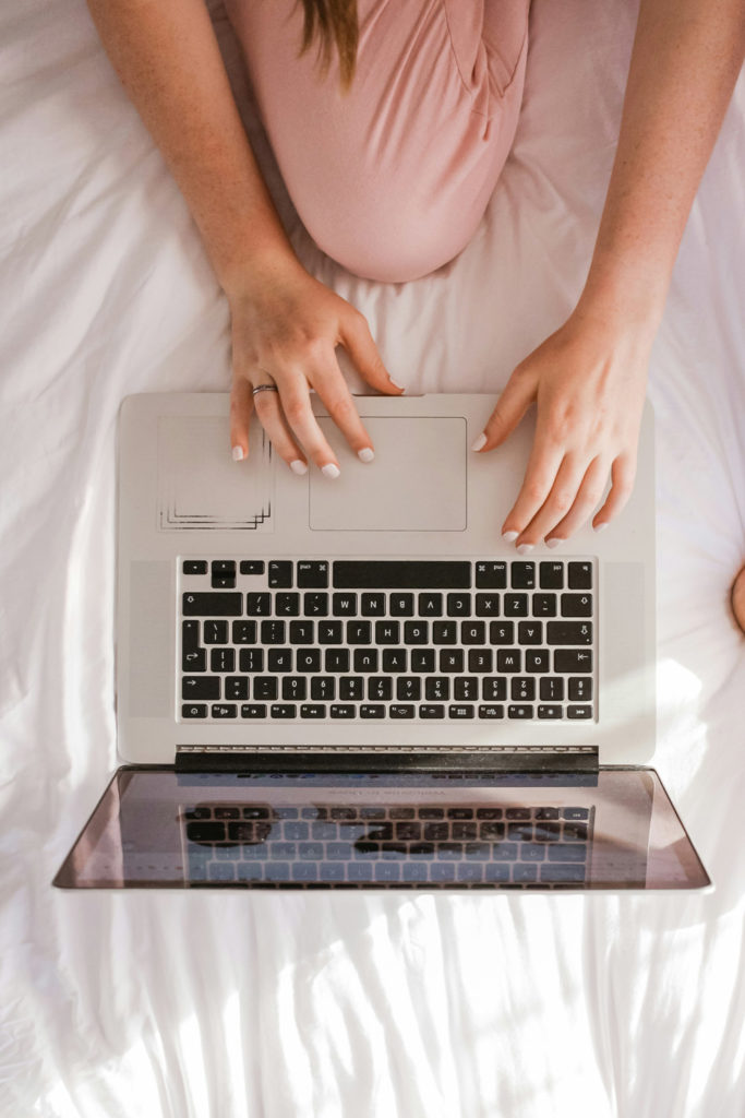 Woman typing on a laptop