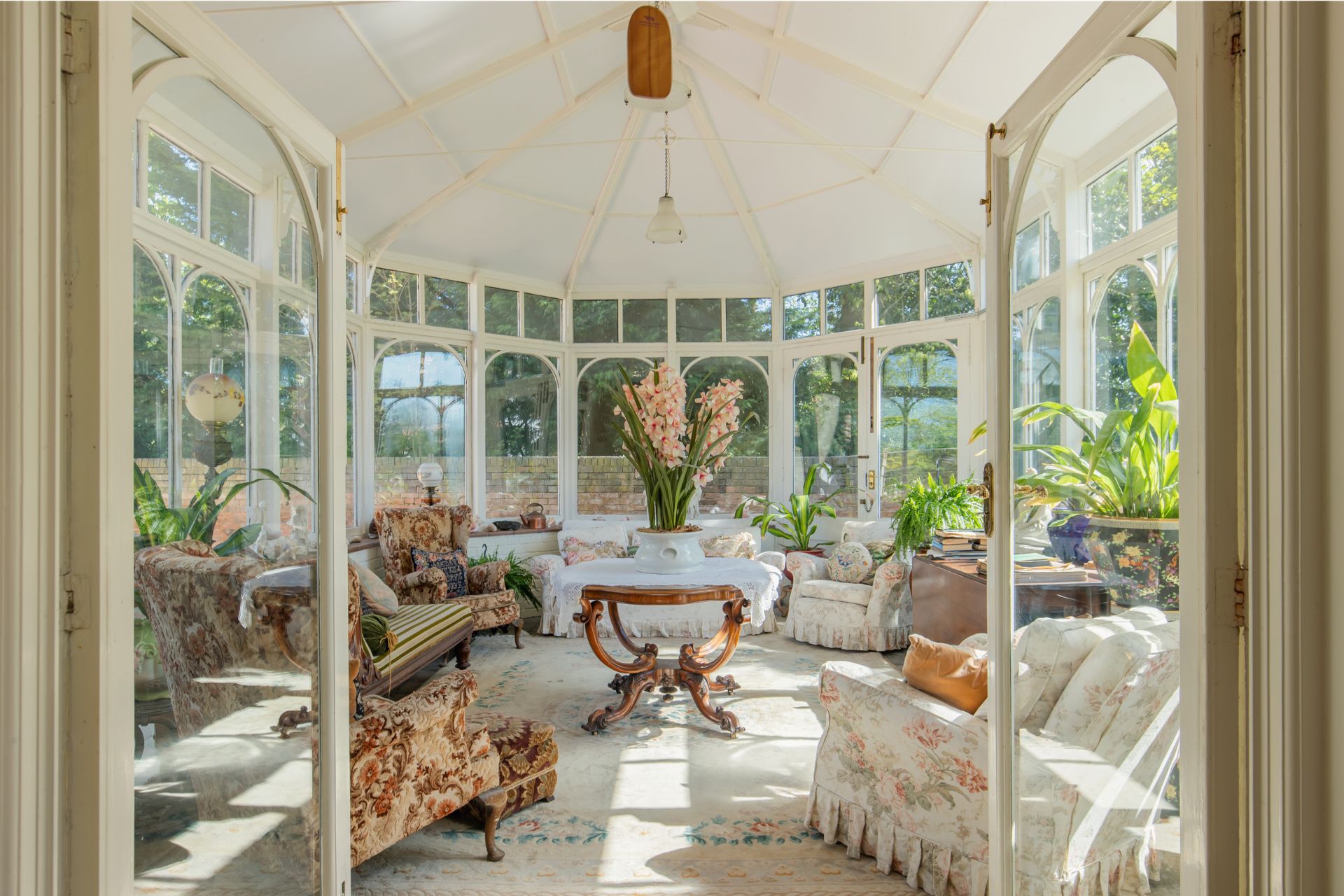 Conservatory with cream and chintz furniture