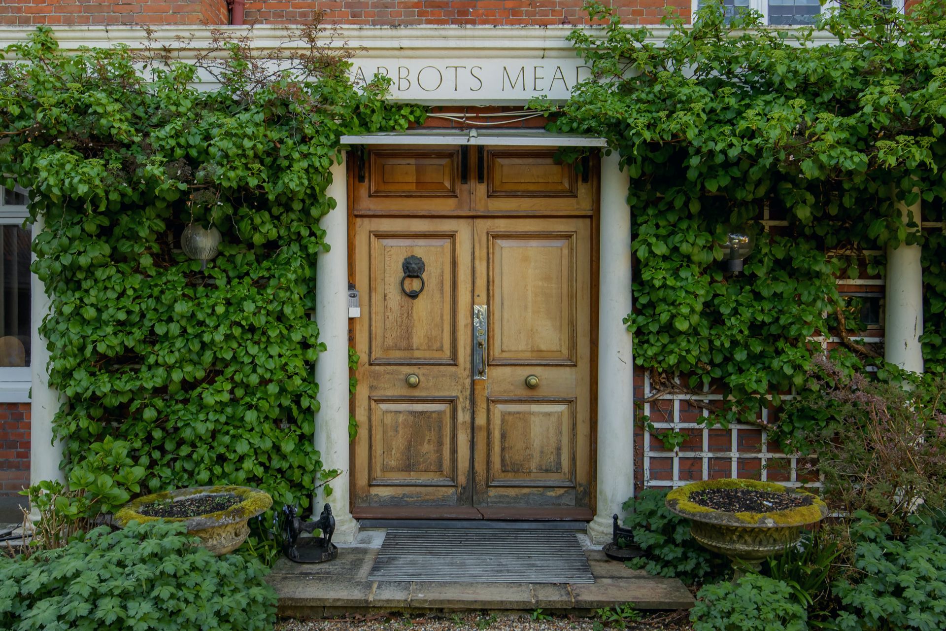 Leafy doorway with period oak door