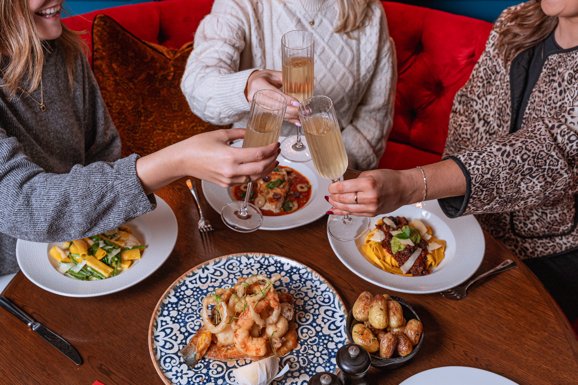 People around a table with plates of food