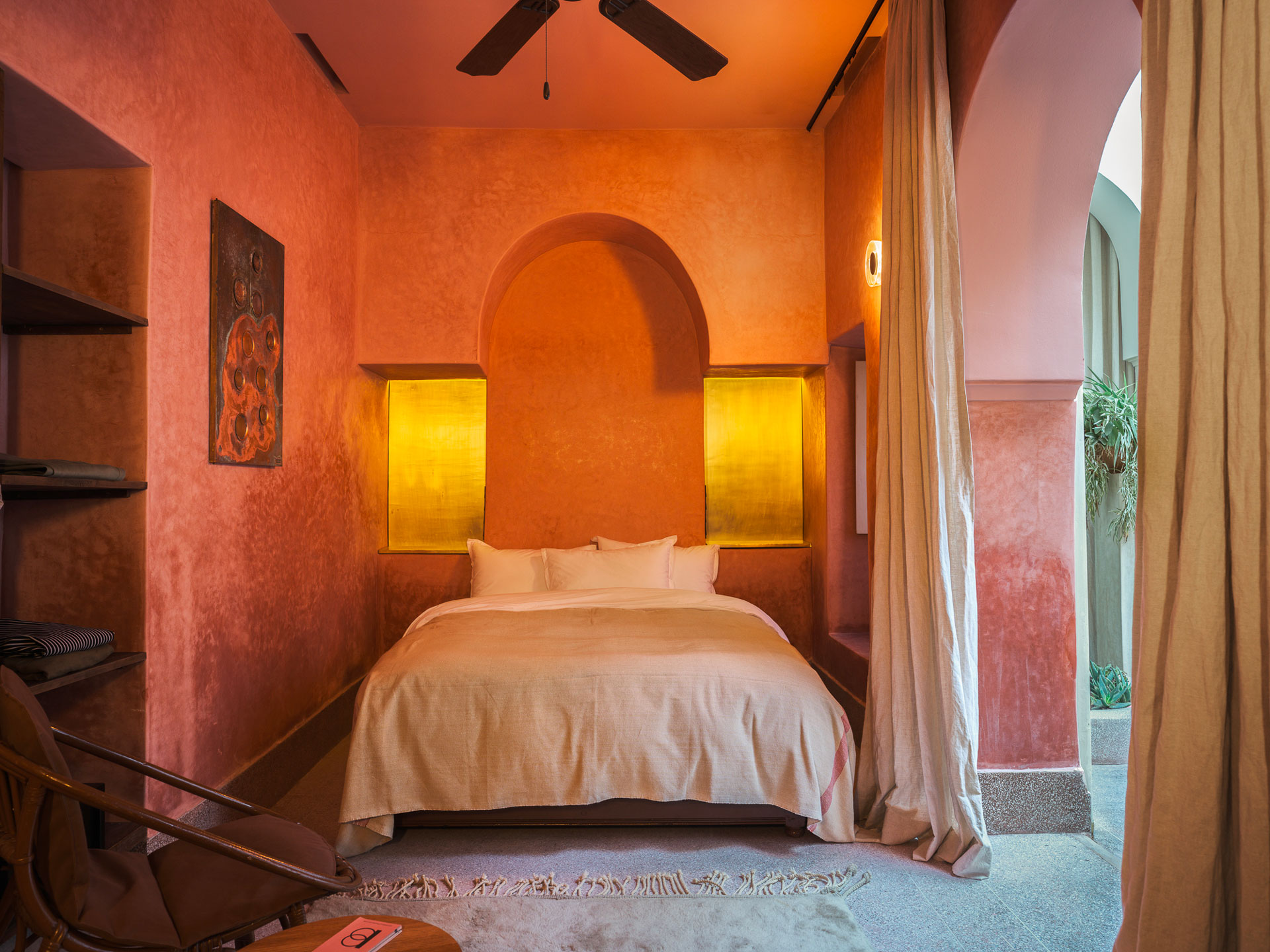 A ground floor bedroom at Riad Brummell. Curtains separate the bedroom from the rest of the building