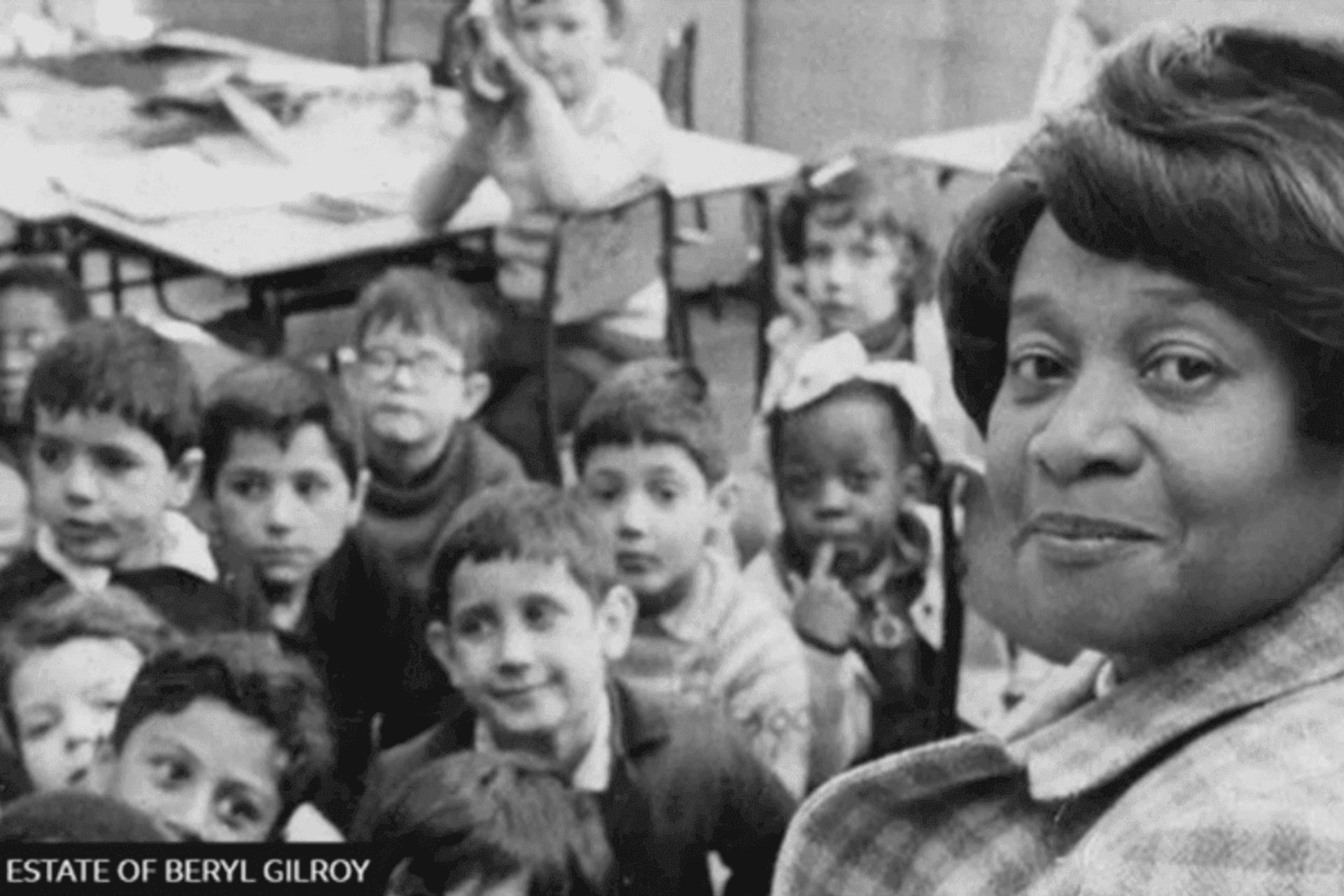 Black and white photo of Beryl Gilroy with schoolchildren