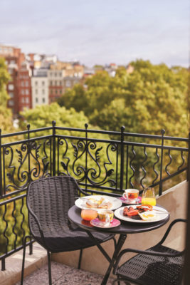 A breakfast table with leafy views over Chelsea