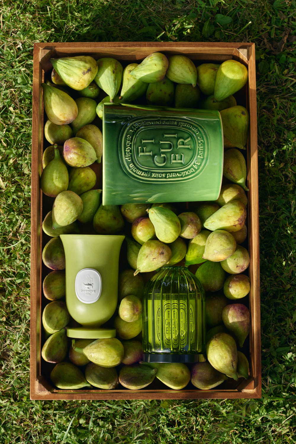 Bow of fruit with green Diptyque products | summer pop-up